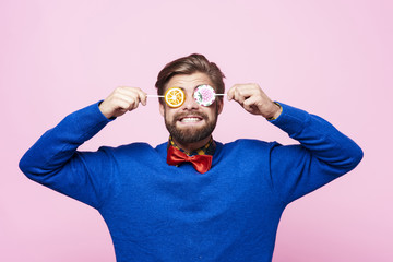 Funny man with lollipops on eyes - obrazy, fototapety, plakaty
