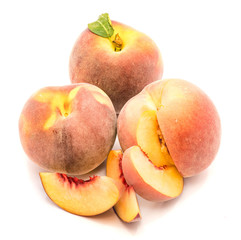 Fototapeta na wymiar Three peaches, two whole, one cut open, three slices, isolated on white background.