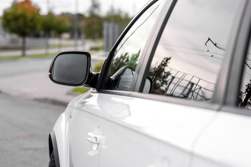 Obraz premium Modern luxury car wing mirror close-up. Expensive, sports auto.