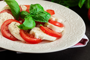 Caprese salad with mozzarella, tomato, basil