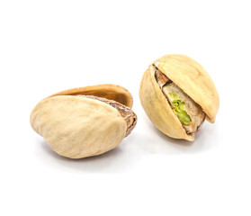 Two whole open pistachio nuts isolated on white background.