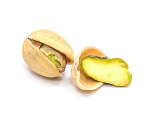 Pistachio nuts isolated on white background, one open, one half in shell.