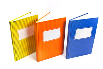 Colorful notebooks isolated on white background