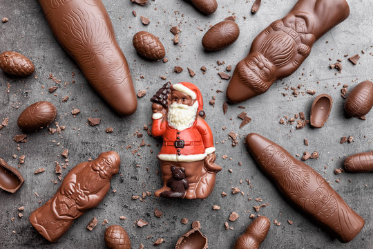 Delicious Christmas chocolate and sweets on rustic background