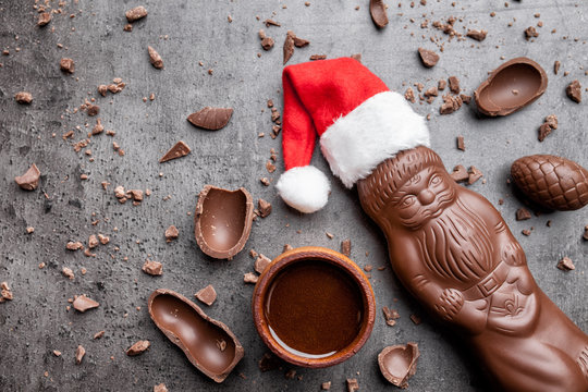 Delicious Christmas chocolate and sweets on rustic background