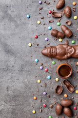 Delicious Christmas chocolate and sweets on rustic background