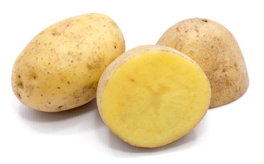 One whole potato and two halves isolated on white background.