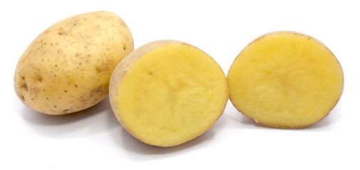 One whole potato and two halves isolated on white background.