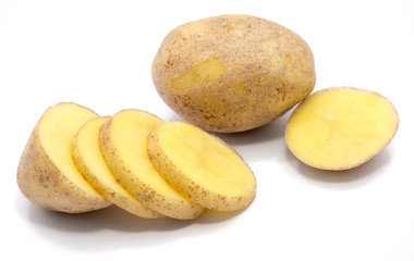 One whole potato with slices isolated on white background.