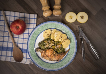Czech food, traditional roasted rabbit with spinach and potato dumplings
