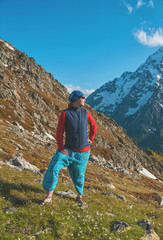 Fototapeta premium Tourist woman hiker on the top of mountain