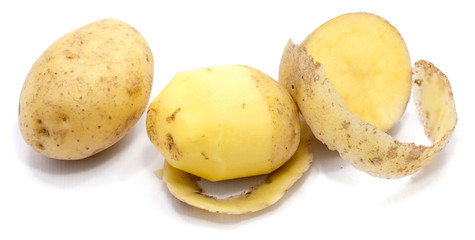 One whole and peeled potatoes isolated on white background.