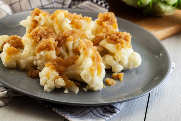 Vegetarian cooked cauliflower with bread crumb