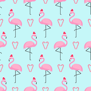 Flamingo in xmas hat with candy cane heart seamless pattern. Exotic New Year art background. Design for fabric, wallpaper, textile and decor.