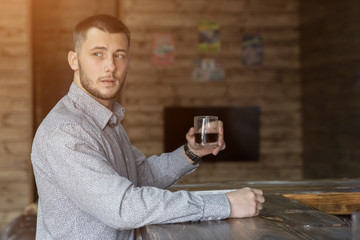 Young handsome man in bar