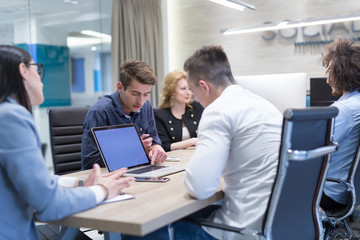 Startup Business Team At A Meeting at modern office building