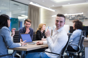 Startup Business Team At A Meeting at modern office building