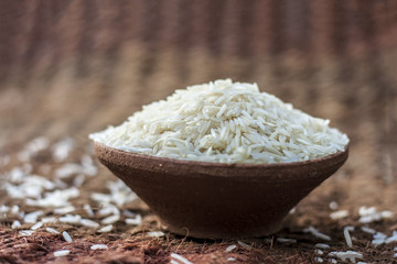 Uncooked White Basmati Rice in a clay bowl. 