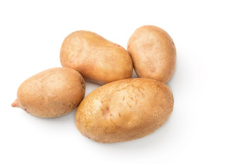 Uncooked, unpeeled, fresh whole potatoes isolated on white background