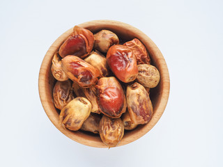 Delicious fresh organic dates over white background
