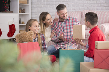Boy unpacking presents