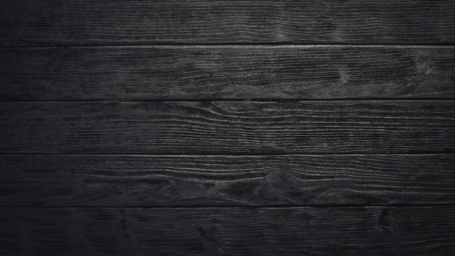 Wooden dark texture background. Top view. Free space.