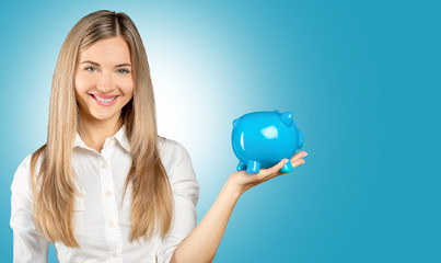 Young woman with piggy bank