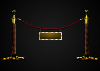 Red velvet rope barrier close-up with a golden banner in the middle. VIP