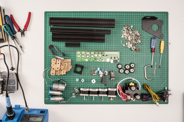 manual assembly of electronic mechanical device from a set of spare part set constructor