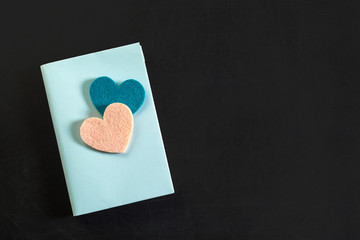 top view of blank notebook with hearts