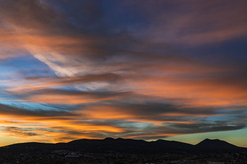 Very textured sunset over a distant mountain range 