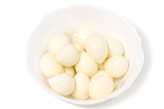 Small mozzarella balls in white bowl