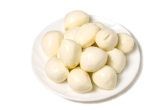 Small mozzarella balls on white plate