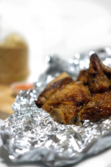Whole roasted chicken on foil