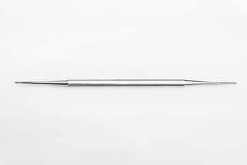 professional manicure tools on a white background. Cuticle pusher
