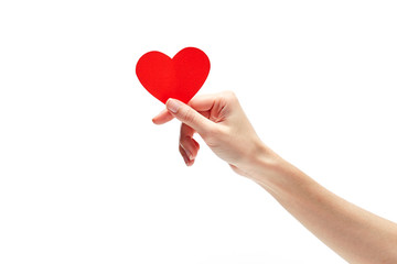 Red heart in woman hand isolated on white