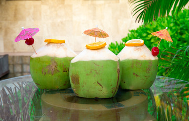 green coconuts with drinking