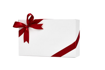 The white box wrapped with red ribbon with a bow
