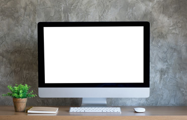 Desktop computer on work desk with blank screen