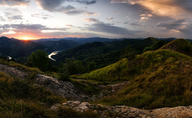 Above Garaventa: Panoramic view on the Lake at Sunrise with a beautiful deep cloudy Sky, Lago del Brugneto, Parco dell'Antola, Liguria,  Italy, Europe