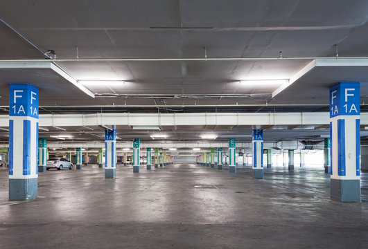Empty parking garage underground interior in apartment or in supermarket.