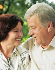 Senior happy couple embracing, outdoors