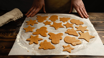 The recipe for making ginger biscuits. Cut cookie dough.