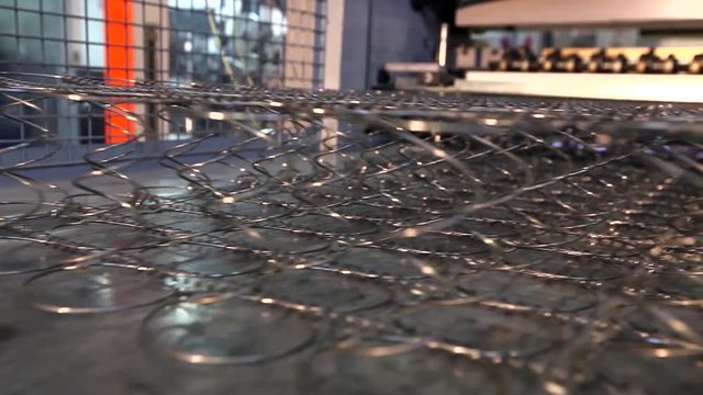 furniture factory, production of furniture springs for mattress blocks, machine for the production of springs, production workshop, the production line, assembly box springs, mattress blocks