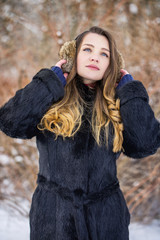 Woman in fur headphones