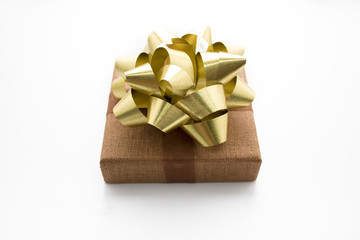 gift box with gold bow ribbon on white isolated in chistmas concept