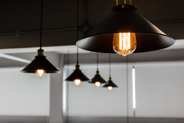 A group of hanging lights with shallow depth of field
