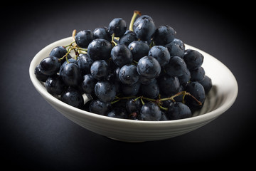 Dark grape in bowl.