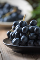 Dark grape in bowl.