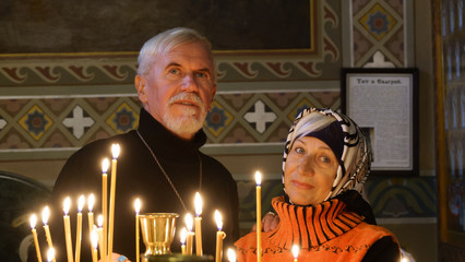 Elderly married couple in orthodox church